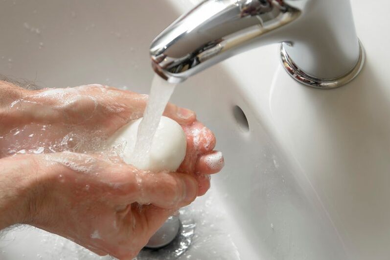 hand washing with soap to prevent worms